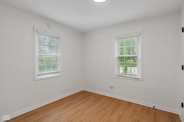 1802 E 66th St, Indianapolis, IN 46220 - unfurnished room featuring light wood-type flooring and a smoke detector