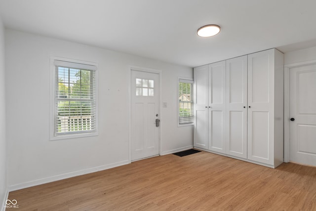 1802 E 66th St, Indianapolis, IN 46220 - entrance foyer featuring light wood finished floors and healthy amount of natural light