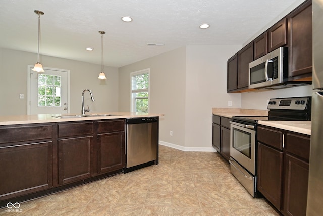 8354 Fieldfare Way, Indianapolis, IN 46237 - kitchen featuring appliances with stainless steel finishes, a sink, healthy amount of natural light, light countertops, and recessed lighting