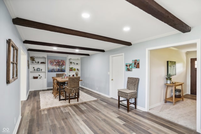 dining space featuring wood finished floors, beam ceiling, baseboards, recessed lighting, and crown molding