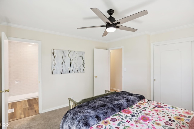 bedroom featuring crown molding, carpet flooring, baseboards, and a ceiling fan