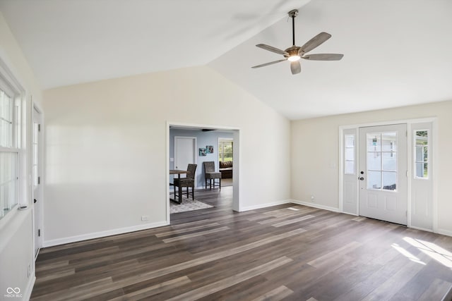entryway with dark wood-style flooring, a ceiling fan, lofted ceiling, and baseboards