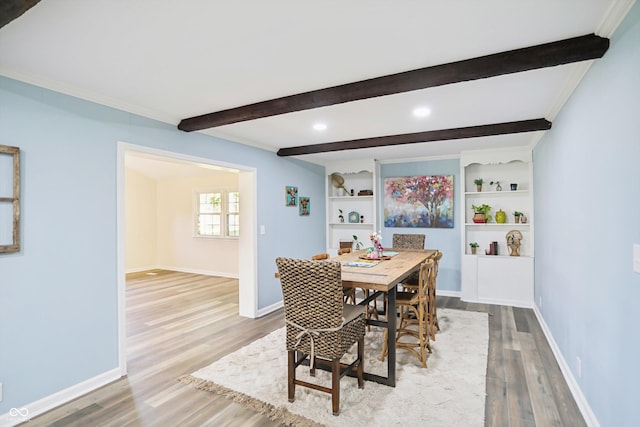 dining area with wood finished floors, beamed ceiling, baseboards, and recessed lighting