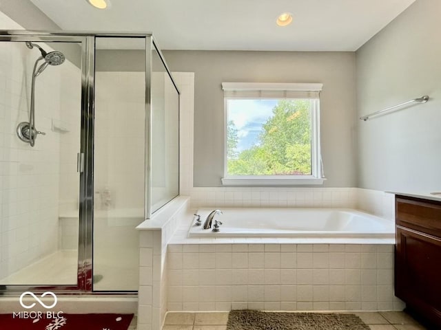 full bathroom with tile patterned floors, a bath, a stall shower, and recessed lighting