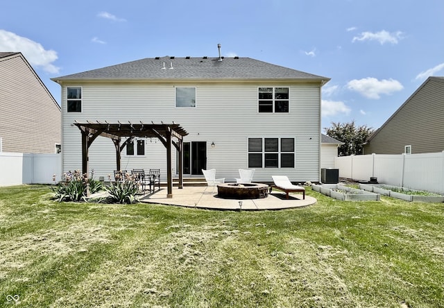 rear view of property featuring a garden, a patio area, central AC, an outdoor fire pit, and a pergola