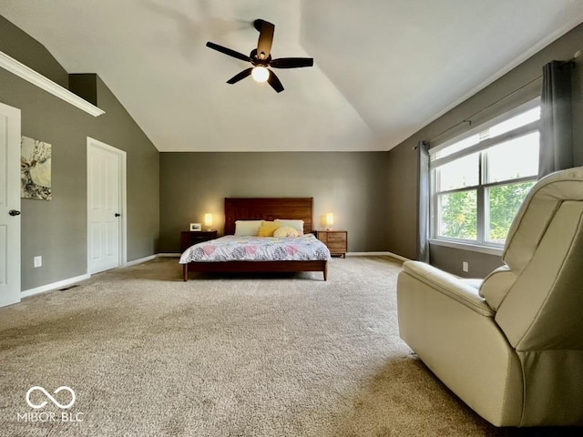 bedroom featuring lofted ceiling, carpet, baseboards, and a ceiling fan