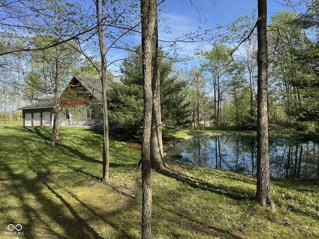 1340 Apache Trl, Martinsville, IN 46151 - view of green lawn with a water view and a detached garage