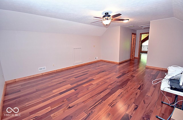 1340 Apache Trl, Martinsville, IN 46151 - spare room with wood finished floors, ceiling fan, lofted ceiling, baseboards, and a textured ceiling
