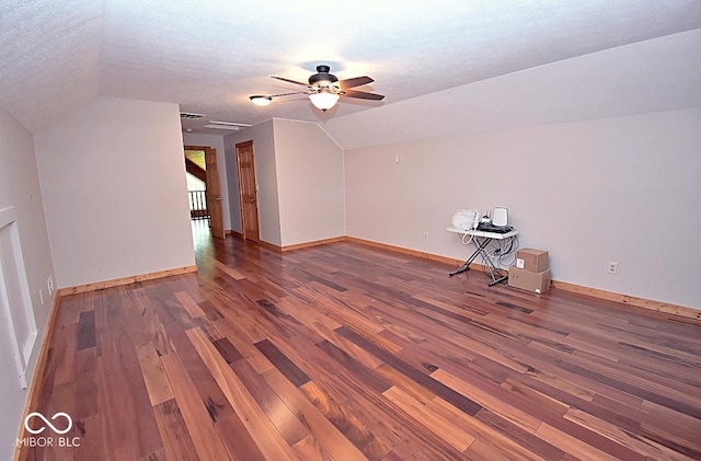 1340 Apache Trl, Martinsville, IN 46151 - additional living space featuring lofted ceiling, wood finished floors, a ceiling fan, baseboards, and a textured ceiling