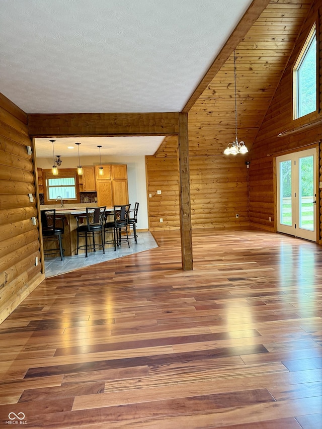 1340 Apache Trl, Martinsville, IN 46151 - living area with light wood-style floors, a chandelier, and wood walls