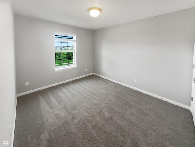 18230 Sandy Cove Ln, Westfield, IN 46074 - unfurnished room with baseboards and dark carpet