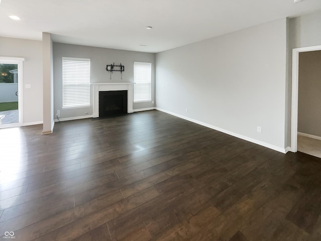 18230 Sandy Cove Ln, Westfield, IN 46074 - unfurnished living room featuring dark wood finished floors, a fireplace with flush hearth, baseboards, and recessed lighting