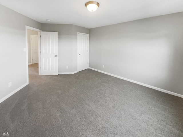 18230 Sandy Cove Ln, Westfield, IN 46074 - unfurnished bedroom with dark colored carpet, baseboards, and a closet