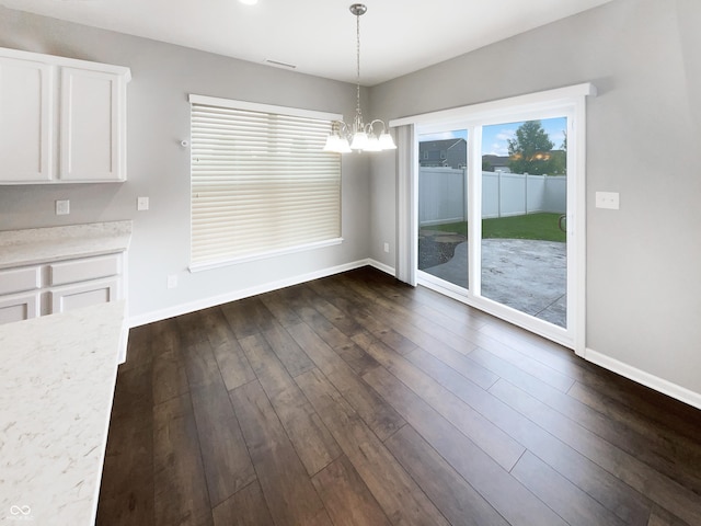 18230 Sandy Cove Ln, Westfield, IN 46074 - unfurnished dining area featuring a chandelier, baseboards, and dark wood finished floors