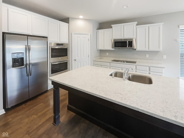 18230 Sandy Cove Ln, Westfield, IN 46074 - kitchen with appliances with stainless steel finishes, a sink, white cabinets, dark wood-type flooring, and recessed lighting