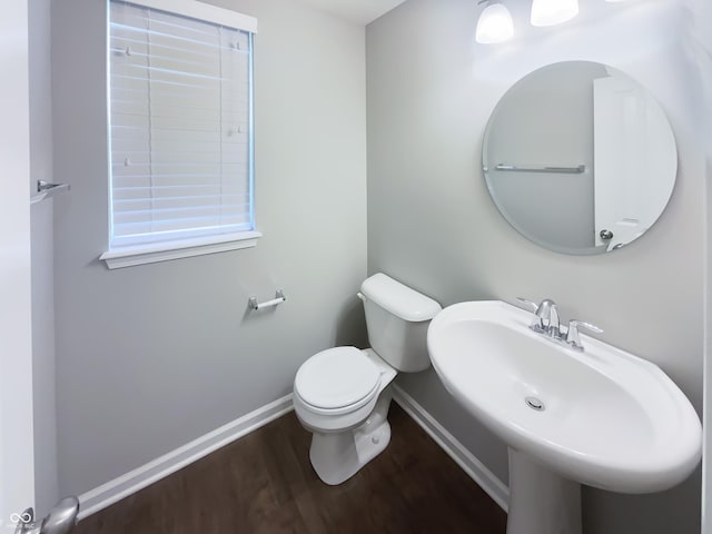 18230 Sandy Cove Ln, Westfield, IN 46074 - half bathroom with baseboards, wood finished floors, toilet, and a sink