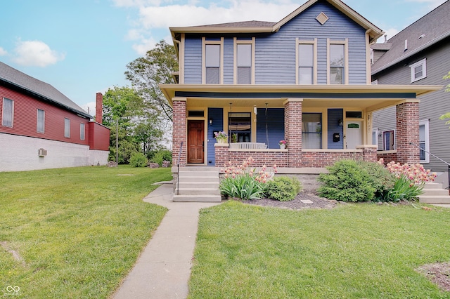 1009 Broadway St, Indianapolis, IN 46202 - view of front of house featuring a front lawn, a porch, and brick siding