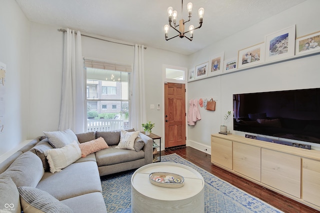 1009 Broadway St, Indianapolis, IN 46202 - living area with dark wood-style floors, a chandelier, and baseboards