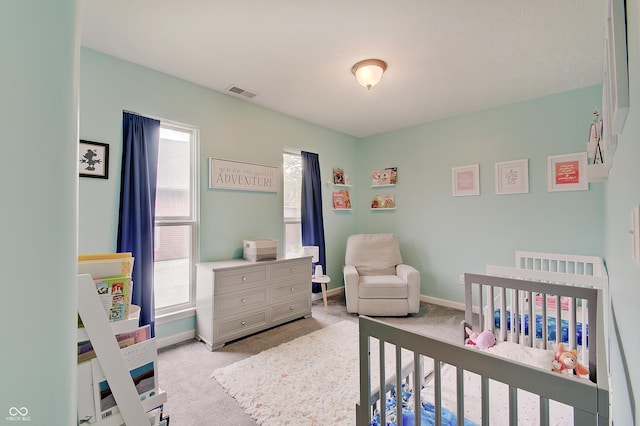 1009 Broadway St, Indianapolis, IN 46202 - carpeted bedroom featuring a nursery area and baseboards