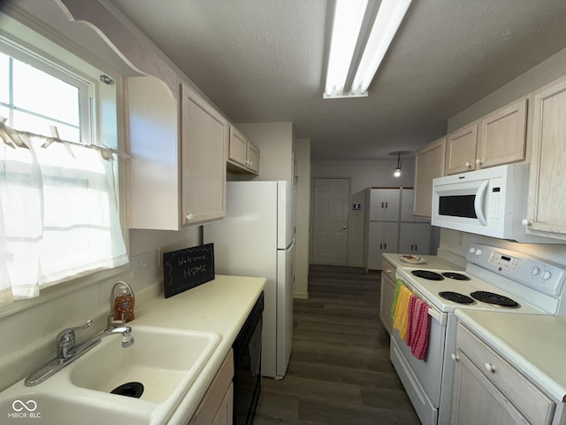 11523 Coastal Way, Indianapolis, IN 46229 - kitchen featuring white appliances, dark wood-style floors, a sink, light countertops, and a textured ceiling