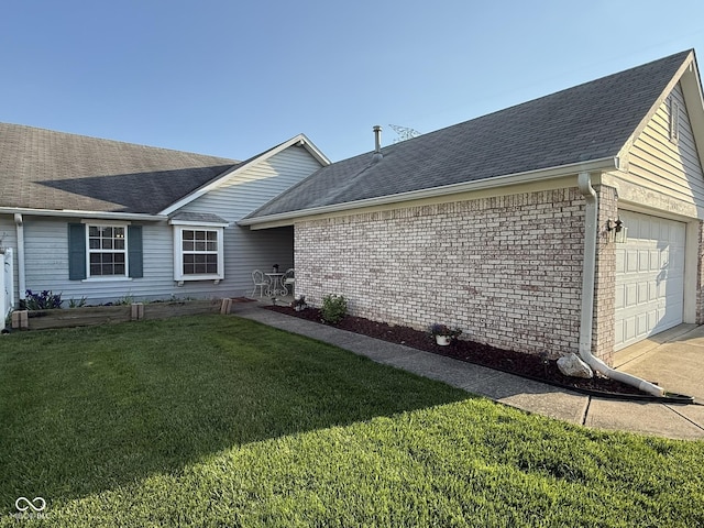 11523 Coastal Way, Indianapolis, IN 46229 - view of side of property with a garage, a lawn, brick siding, and roof with shingles
