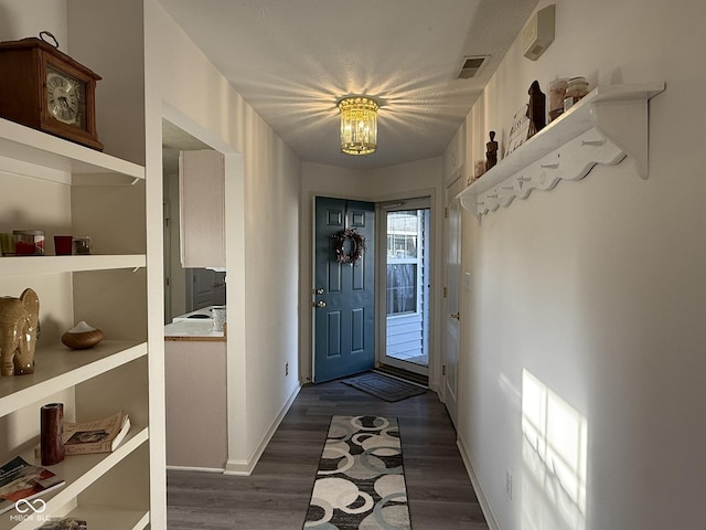 11523 Coastal Way, Indianapolis, IN 46229 - foyer with dark wood-style flooring and baseboards