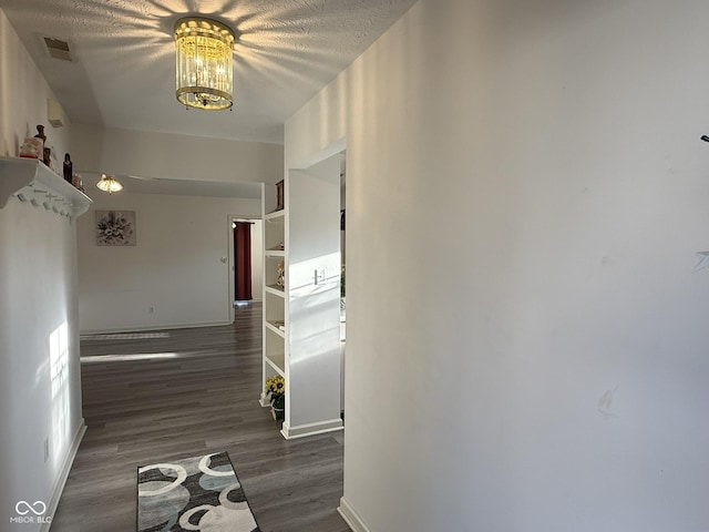 11523 Coastal Way, Indianapolis, IN 46229 - corridor with a chandelier, baseboards, and wood finished floors