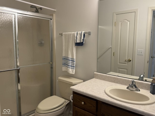 11523 Coastal Way, Indianapolis, IN 46229 - full bathroom featuring a shower stall, vanity, and toilet