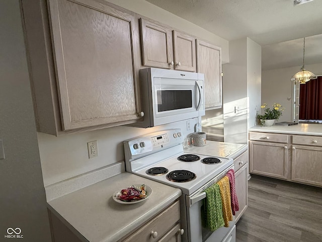 11523 Coastal Way, Indianapolis, IN 46229 - kitchen with white appliances, light countertops, dark wood-style floors, and decorative light fixtures