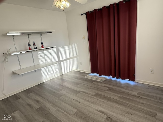 11523 Coastal Way, Indianapolis, IN 46229 - spare room with wood finished floors, ceiling fan, and baseboards