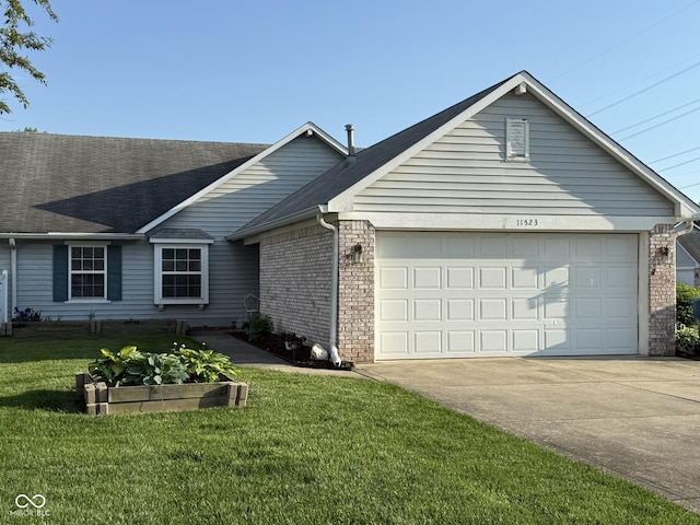 11523 Coastal Way, Indianapolis, IN 46229 - ranch-style home with an attached garage, driveway, a front yard, a shingled roof, and brick siding