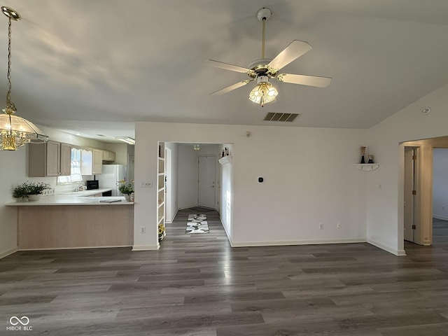 11523 Coastal Way, Indianapolis, IN 46229 - unfurnished living room featuring dark wood finished floors, ceiling fan, baseboards, a chandelier, and vaulted ceiling