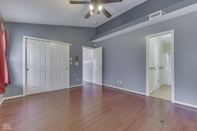 6542 E Edna Mills Dr, Camby, IN 46113 - unfurnished bedroom featuring lofted ceiling, wood finished floors, baseboards, a closet, and ceiling fan