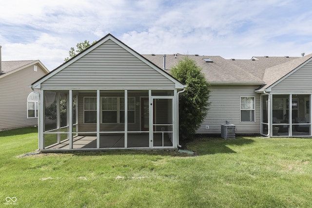 6542 E Edna Mills Dr, Camby, IN 46113 - back of house featuring a sunroom, a yard, central AC, and a shingled roof