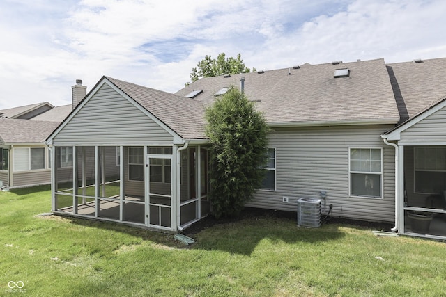 6542 E Edna Mills Dr, Camby, IN 46113 - back of property featuring a sunroom, a shingled roof, central air condition unit, a lawn, and a chimney