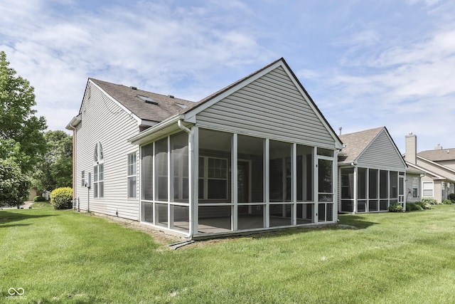 6542 E Edna Mills Dr, Camby, IN 46113 - rear view of house with a sunroom, a yard, and roof with shingles