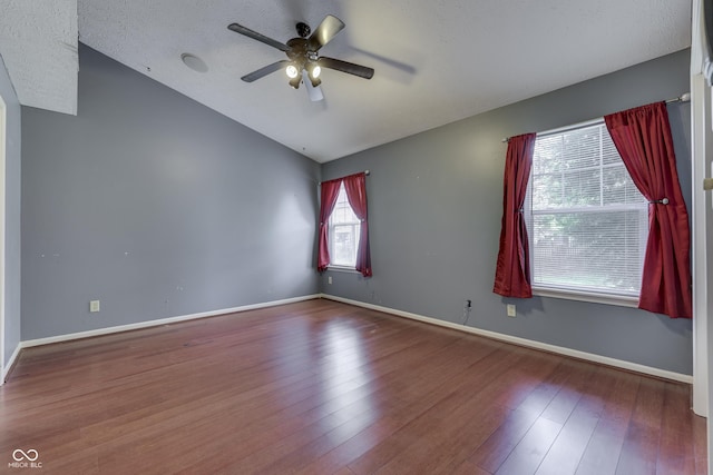 6542 E Edna Mills Dr, Camby, IN 46113 - unfurnished room with ceiling fan, lofted ceiling, wood finished floors, baseboards, and a textured ceiling