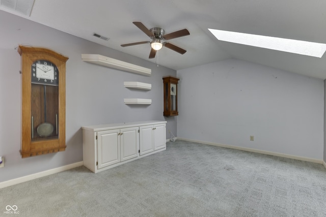 6542 E Edna Mills Dr, Camby, IN 46113 - bonus room featuring a skylight, ceiling fan, light carpet, vaulted ceiling, and baseboards