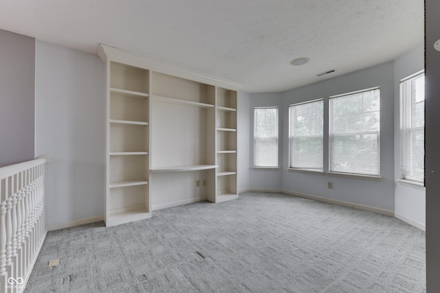 6542 E Edna Mills Dr, Camby, IN 46113 - unfurnished bedroom featuring carpet flooring, multiple windows, baseboards, and a textured ceiling