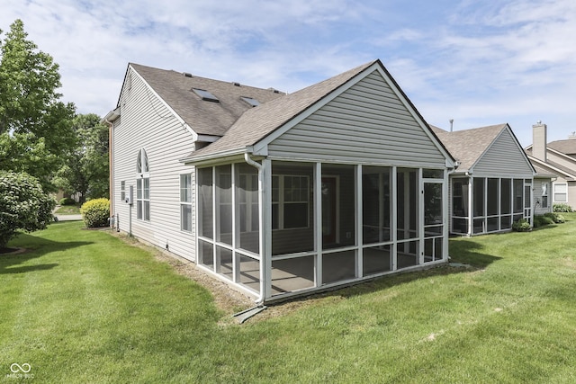 6542 E Edna Mills Dr, Camby, IN 46113 - rear view of property featuring a sunroom, a shingled roof, and a yard