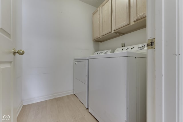 6542 E Edna Mills Dr, Camby, IN 46113 - laundry area featuring washer and dryer, cabinet space, light wood-style floors, and baseboards