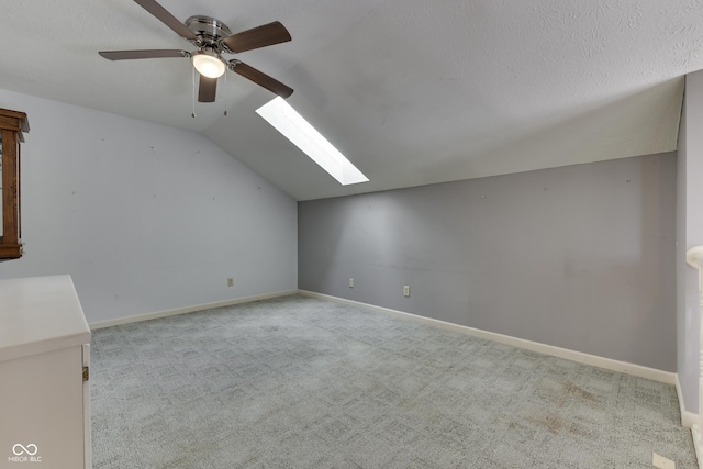 6542 E Edna Mills Dr, Camby, IN 46113 - additional living space featuring lofted ceiling, carpet, a skylight, ceiling fan, and baseboards