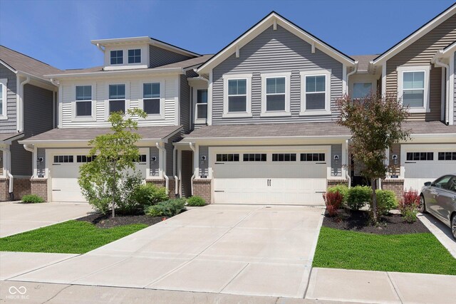 9604 Beckett St, Avon, IN 46123 - townhome / multi-family property with concrete driveway, a garage, and brick siding
