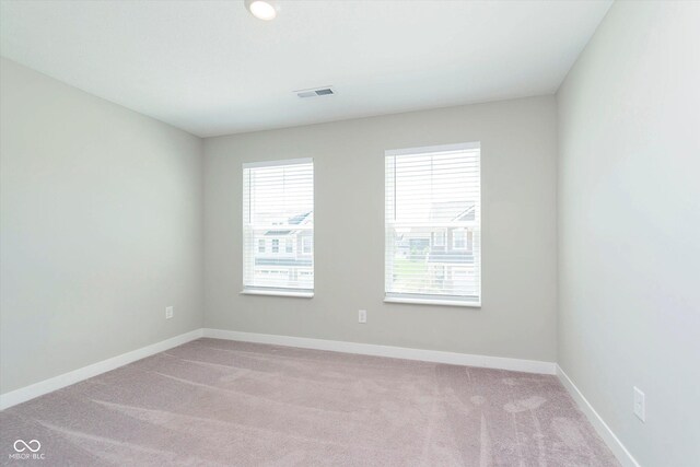9604 Beckett St, Avon, IN 46123 - empty room with healthy amount of natural light, light carpet, and baseboards