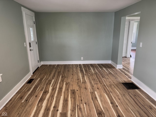671 E Bethel Rd, Attica, IN 47918 - empty room with dark wood-style floors and baseboards