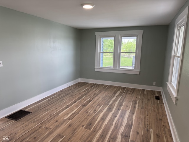 671 E Bethel Rd, Attica, IN 47918 - spare room featuring dark wood-style flooring and baseboards