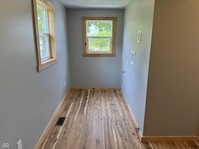 671 E Bethel Rd, Attica, IN 47918 - empty room featuring healthy amount of natural light, baseboards, and wood finished floors