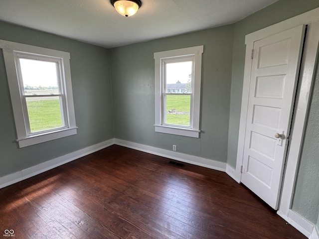 671 E Bethel Rd, Attica, IN 47918 - unfurnished room featuring dark wood finished floors and baseboards