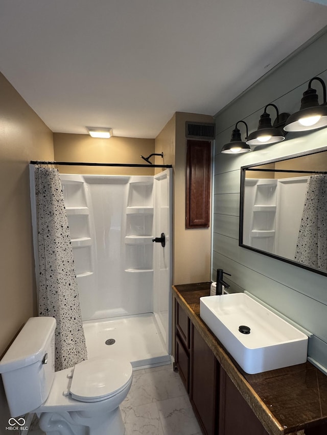 671 E Bethel Rd, Attica, IN 47918 - bathroom with marble look tiles, toilet, a shower with shower curtain, and vanity