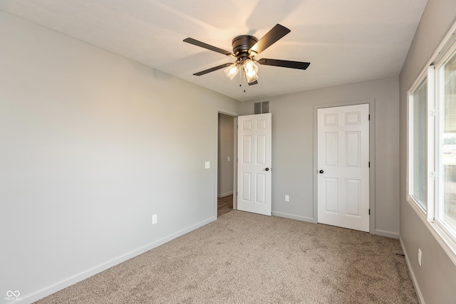 521 Sunset Dr, Edinburgh, IN 46124 - unfurnished bedroom with carpet, baseboards, and ceiling fan